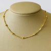 CHOKER TRABALHADA COM BOLAS E PALITOS BANHO DOURADO
