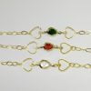PULSEIRA DOIS CORACOES VAZ E UMA ZIRC BANHO DOURADO